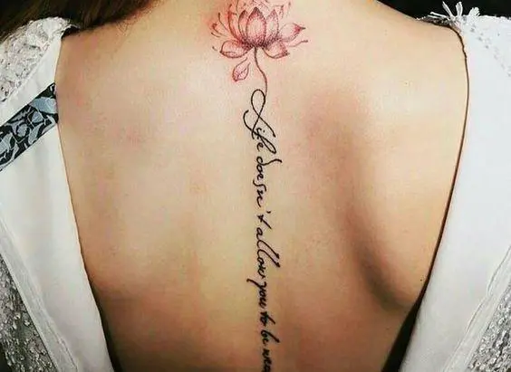 female tattoo lettering on the back